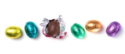 Chocolate easter eggs wrapped in multicolored foil isolated on white background