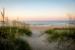 A gentle sunset on the sand dunes of the Outer Banks