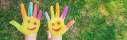 Children's hands in the colors of summer. Selective focus.arts