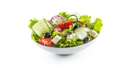 Salad with fresh vegetables olives tomatoes red onion greek cheese feta and olive oil isolated on white background.