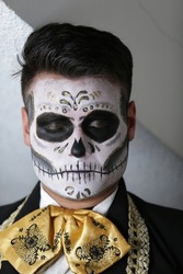young man with skull make-up, for day of the dead festival