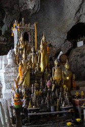 Buddha statues in the lower Pak Ou Cave or the Caves of the thousand buddhas besides the Mekong river 25km upstream of Luang Prabang