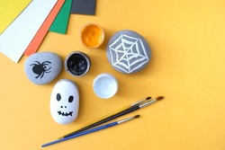 Drawing on stones Halloween characters. Art project for children.Diy concept.Halloween party decor.