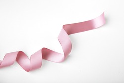 Pink curly ribbon isolated on white