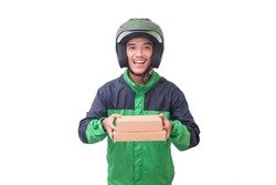 Portrait of Asian online courier driver wearing green jacket and helmet delivering package and box for customer. Isolated image on white background