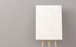 Wooden easel with blank canvas in a living room. minimal style concept.