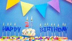 Word from the letters of happy birthday candles for twenty one years. Copy space Happy birthday greetings for 21 years old, lit candles with holiday decorations. Beautiful holiday card