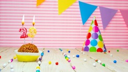 Happy birthday for 29 years old. Festive background with muffin. Copy a birthday card for a twenty-nine year old on a pink background