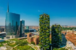Aerial view of Bosco Verticale in Milan Porta Nuova district also known as Vertical forest buildings. Residential buildings with many trees and other plants in balconies