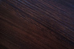 Textured wood, diagonal pattern, dark brown, painted, shiny.