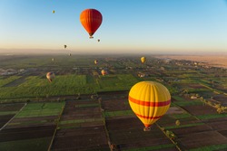 Hot air Balloons above Luxor city in a morning sunrise, Upper Egypt, Africa