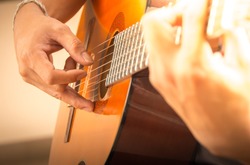 Man playing guitar , close up