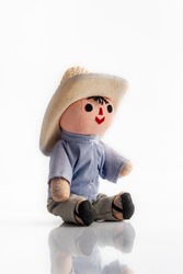 Small mexican doll on white background