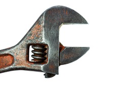 Adjustable wrench. Plumbing work in construction. Tool for work. Close-up. Isolated background.