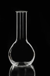 Laboratory glass chemical flask on a black background. Laboratory equipment