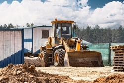 Powerful crawler bulldozer close-up at the construction site. Construction equipment for moving large volumes of soil. Modern construction machine. Road building machine