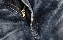 close-up zipper open on blue jeans, denim texture, zipper jeans pants half open