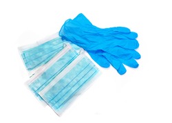 personal protective equipment pair of blue latex gloves with a face mask , that you might wear to portect you from a virus , isolated on a white background 