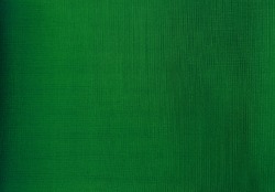 close up detail of green fabric texture background. interior curtain fabric texture background. texture of fabric for forest or natural concept background.