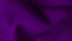 purple or violet textile cloth background abstract with soft waves. close up drapery background with softness mood and tone. 