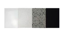 samples of acrylic artificial stone or quartz stone for countertops. model from stones, close-up. modern white, grey, black colored stone isolated on white background with clipping path.
