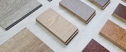 samples of interior wooden flooring material consists oak, walnut, ash, douglasfir engineering (or laminate) flooring, ash and oak vinyl tile. perspective view of selected materials on board.