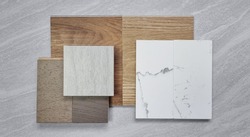 mood board. material samples for interior design contains travertine ceramic tile, white statuario marble quartz, walnut and douglasfir laminated floorings, wooden oak vinyl flooring tiles.