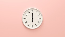 Closeup white wall clock set on light pink background.  White wall clock hanging on the wall. Minimalist flat lay image of plastic wall clock over pink background. Copy space and central composition.