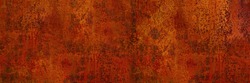 Rusty metal background. Rust texture. Orange red brown abstract background. Bright rough textured background. Wide banner. Panoramic. Copy space.