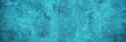   Blue green abstract background. Toned rough rock surface texture. Beautiful teal background with copy space for design. Wide banner. Panoramic.                             