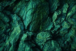    Green yellow rock texture. Toned rough mountain surface texture. Crumbled. Close-up. Rocky background with space for design. Fantasy.                            