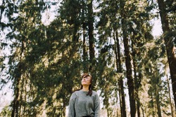 Young woman in nature. People and forest. Healthy life style. Happy walk in park. Outdoor activity casual girl lifestyle. Mind developing and maintaining positive energy. Happily Daily life