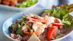 Spicy Vermicelli Seafood Salad with vegetable ingredient Thai food Street food Concept.