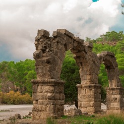 Ruins of aquaeduct in ancient city Phaselis, Antalya Province, Turkey. Lycian ancient civilization heritage.