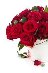 Red roses in bucket isolated on white background.