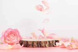 Empty wooden podium with rose and petals for display gifts, products or cosmetics