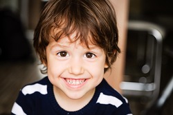 Portrait of happy child toddler boy smiling close up
