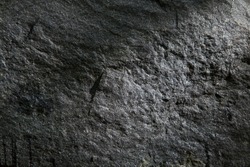 Stone textured background in a low key