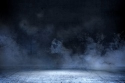 Room with concrete floor and smoke with dark wall background