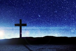 Christian Cross on the field with a night scene background