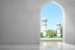 Mosque door with a green garden and blue sky background