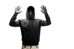 A criminal man in a hidden mask raised a hand for arrested isolated over white background