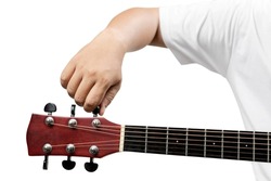 Man tuning guitar string isolated over white background