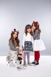 Small girls best girlfriends in a beautiful style fashion clothes collection of dress suit skirt flower crown, happy birthday celebration, funny party kids, dance smile hug daughter sisters children