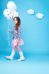 Beautiful little cute girl smile long dark hair take balloons wear style fashion silk cotton dress spring mood children clothing childhood daughter pretty face collection sister friend happy fun