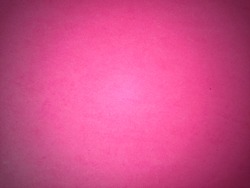 Bright pink background, close to lilac and fuchsia. Dark light vignetting around the edges. Background, greeting card or declaration of love.