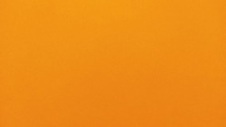 Nice yellow background. A sheet of paper close-up. Pure cheerful color. Vivid shade of yellow, close to orange
