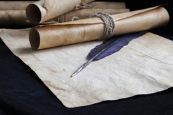 Ancient paper scrolls sealed with a seal on an old map. Pen for writing.