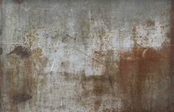 rusty metal surface with gray and light brown tones - worn steampunk background with scratches and grooves	