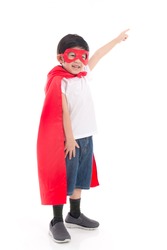 Cute Asian child  in Superhero's costume pointing on white background isolated